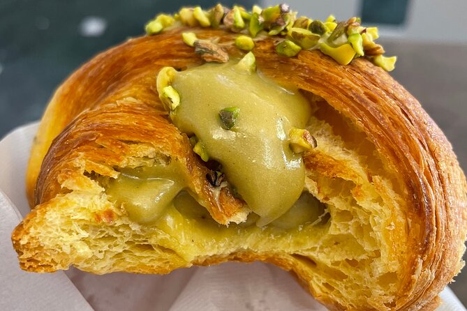 You'll be tasting cornetto al pistacchio, a classic Italian breakfast pastry on this sweet Florence food tour!