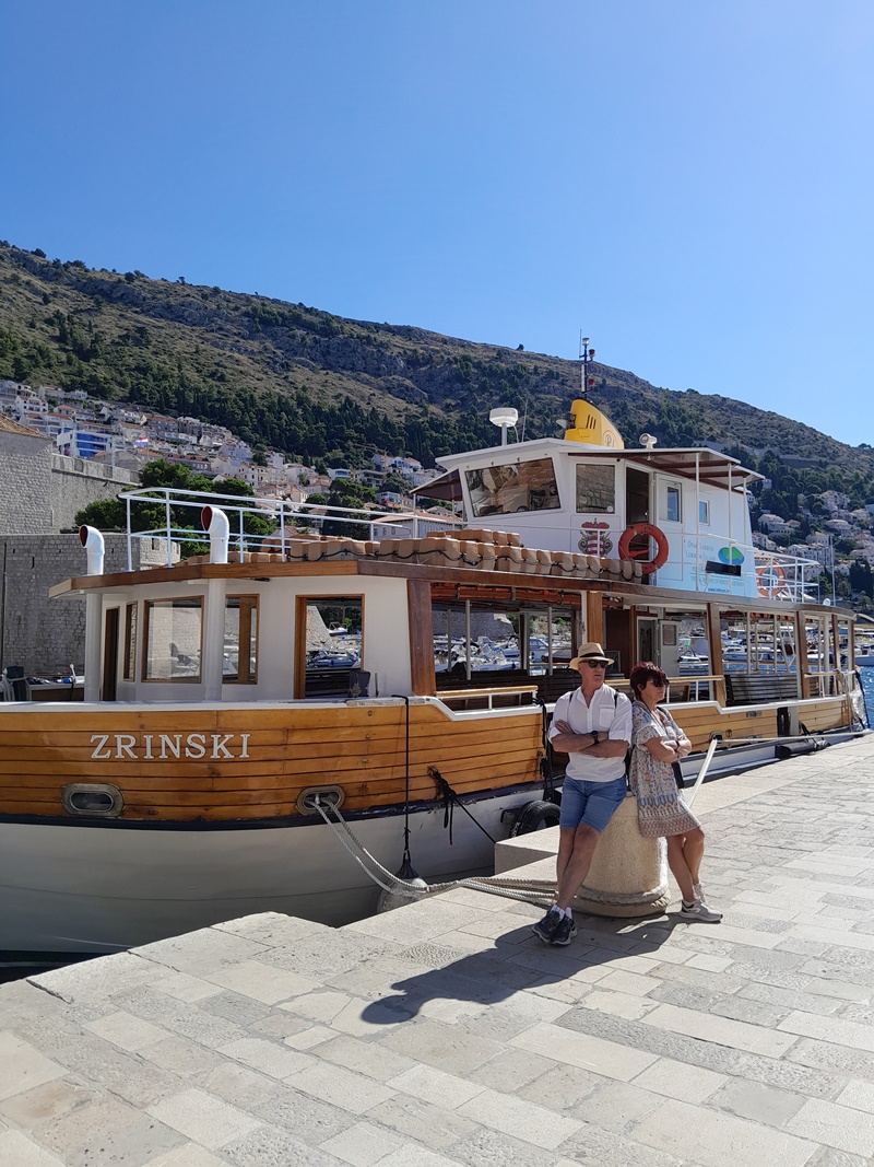 A ferry to Lokrum Island departing from Dubrovnik’s Old Town, offering scenic views of the city and Adriatic Sea.
