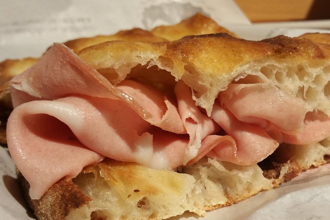 You'll be snacking pizza bianca with mortadella on this walking food tour in Rome!