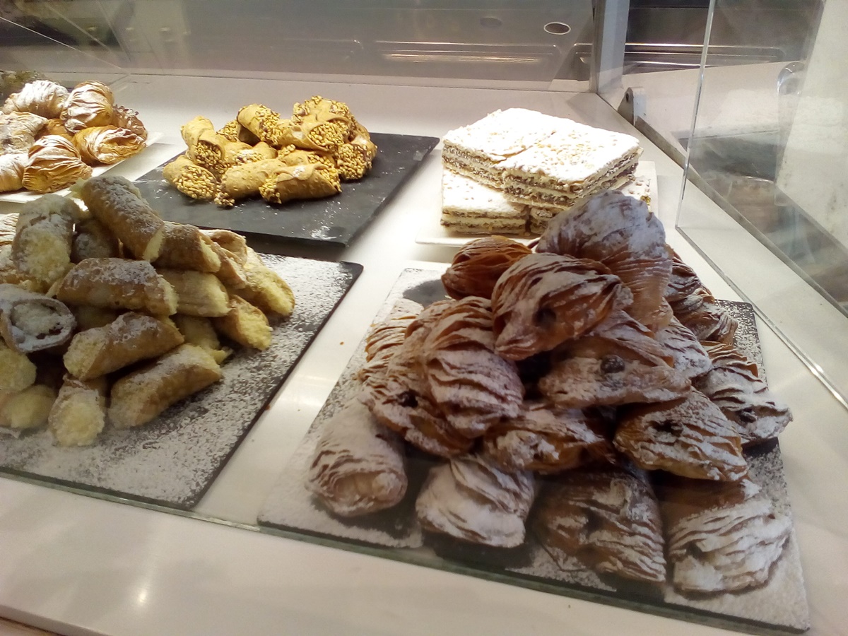Cannoli and sfogliatelle, popular Italian pastries Cannoli and sfogliatelle, popular Italian pastries