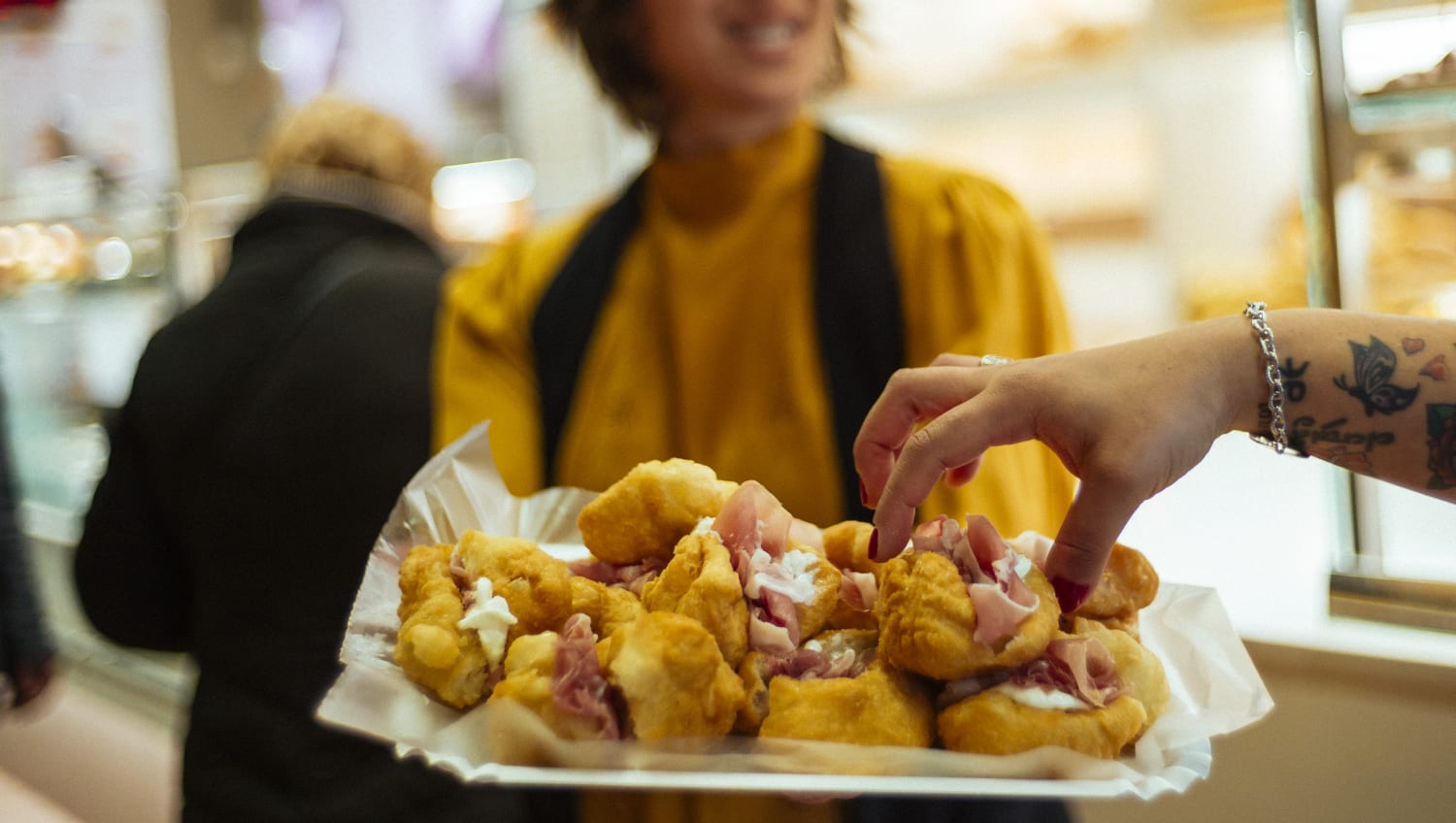 You'll be eating freshly fried coccoli on this private food tour in Florence!